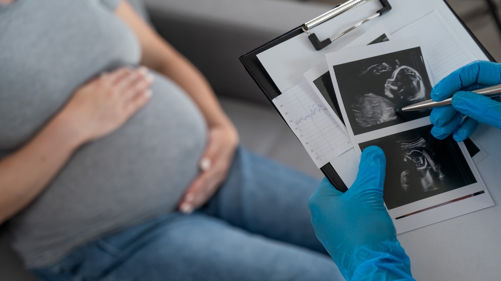 pregnant woman at doctors.